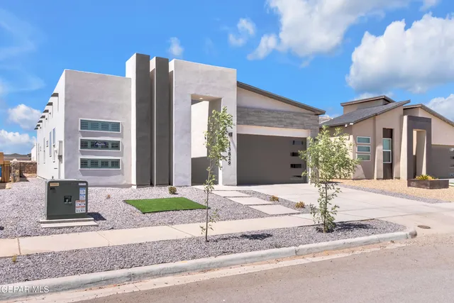 a view of a hallway with wooden floor and entryway