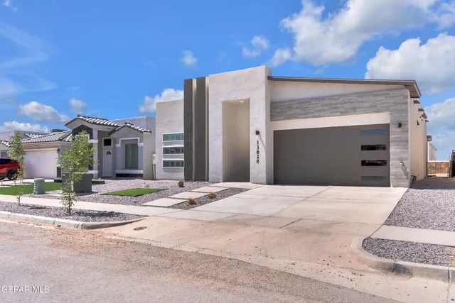a view of an empty walk in closet with wooden floor