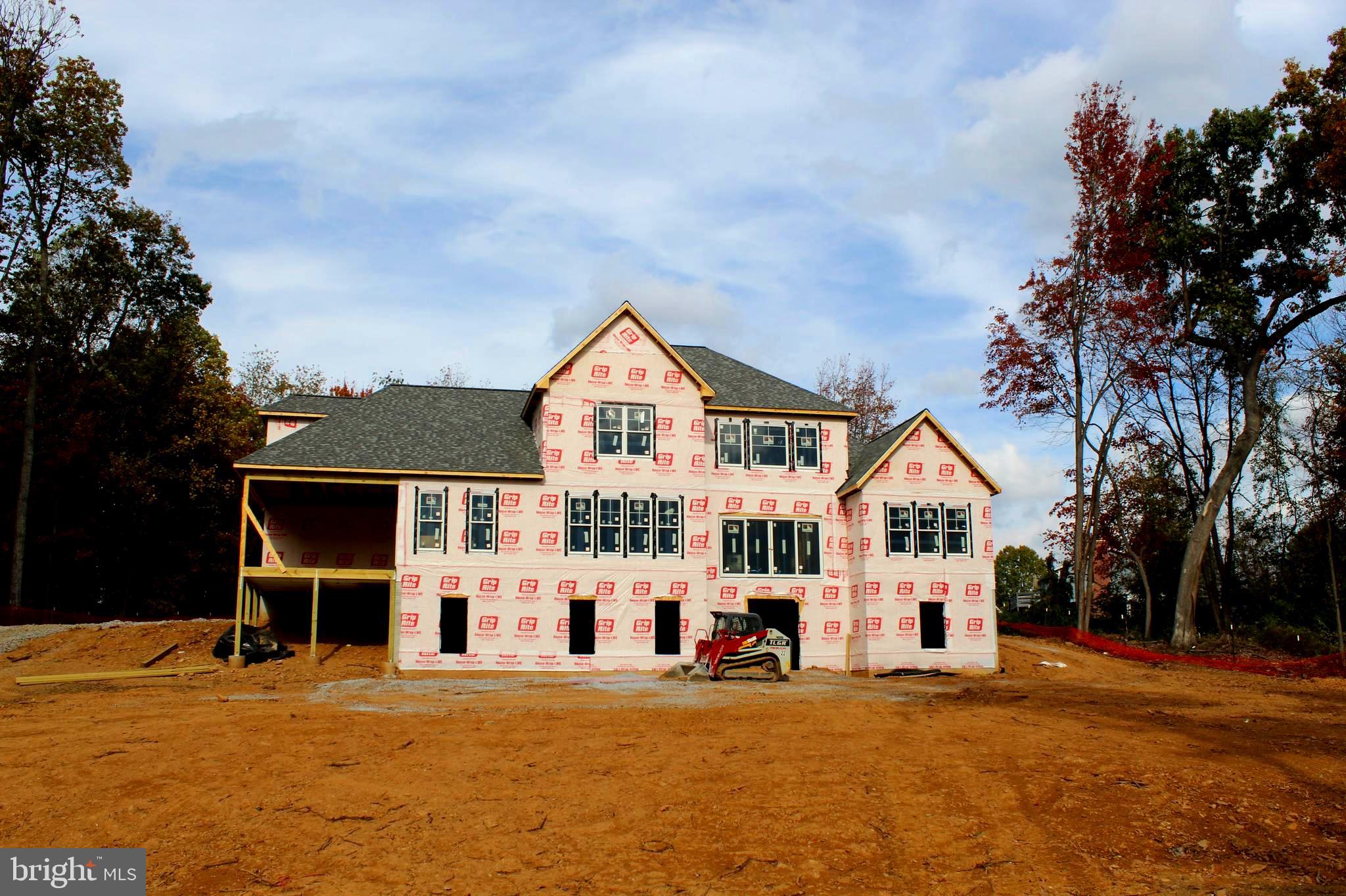 2624 Bachman Road Manchester, MD 21102 - Photo 8 of 18 a view of a house with a big yard and large trees