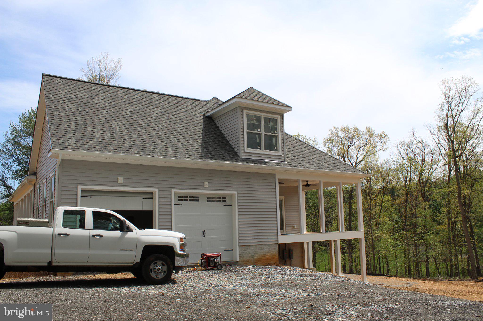 2624 Bachman Road Manchester, MD 21102 - Photo 8 of 41 a front view of a house with parking space