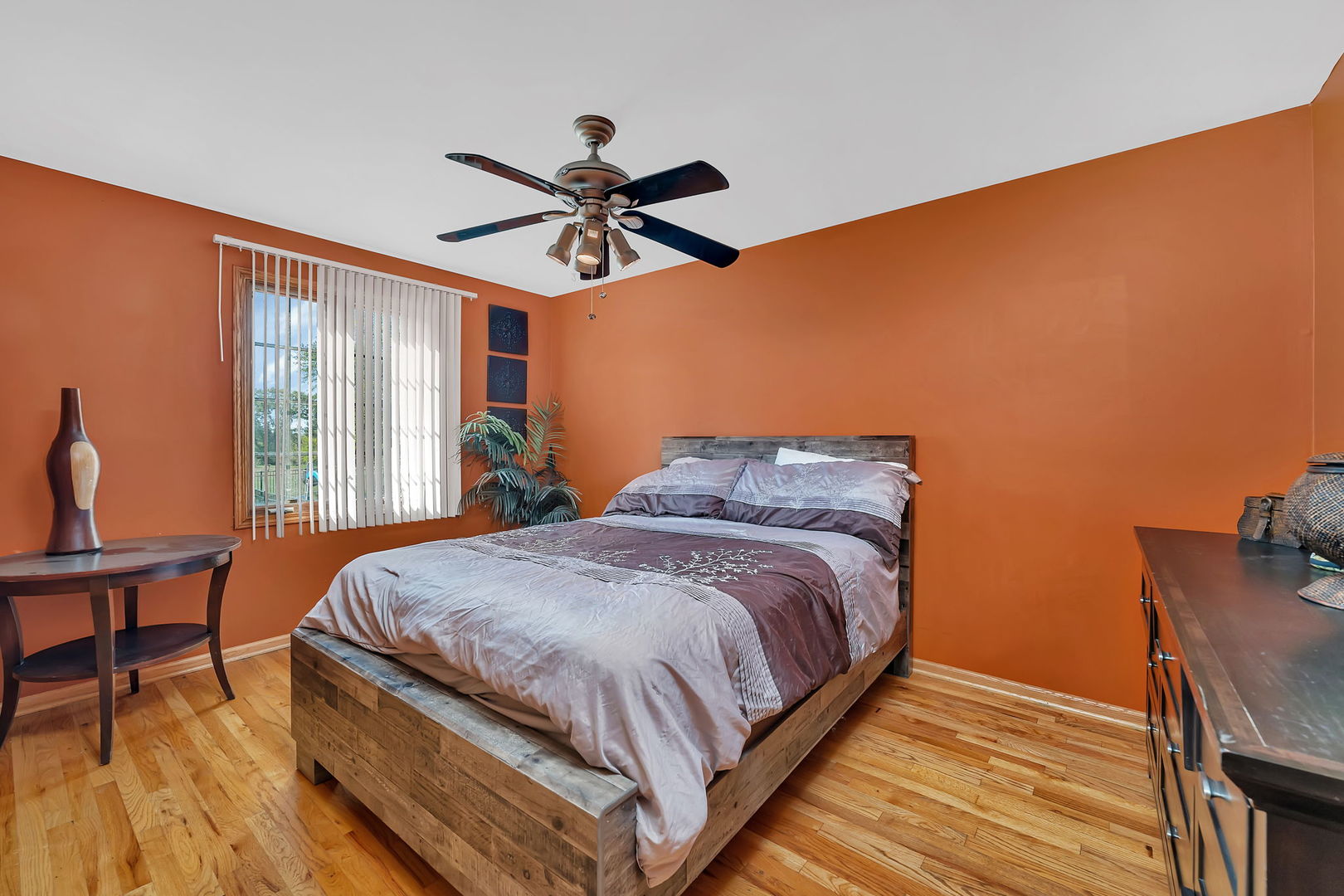 9417 West Steger Road Frankfort, IL 60423 - Photo 21 of 52 a bedroom with a bed and wooden floor