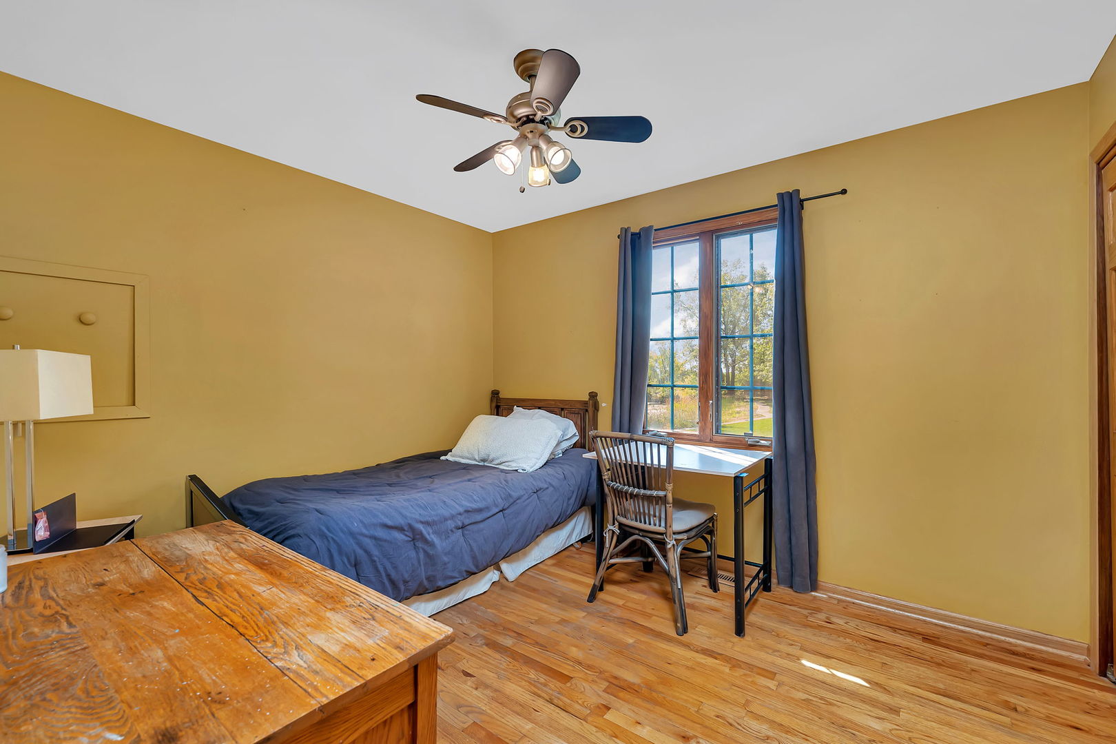 9417 West Steger Road Frankfort, IL 60423 - Photo 22 of 52 a bedroom with a bed and a table