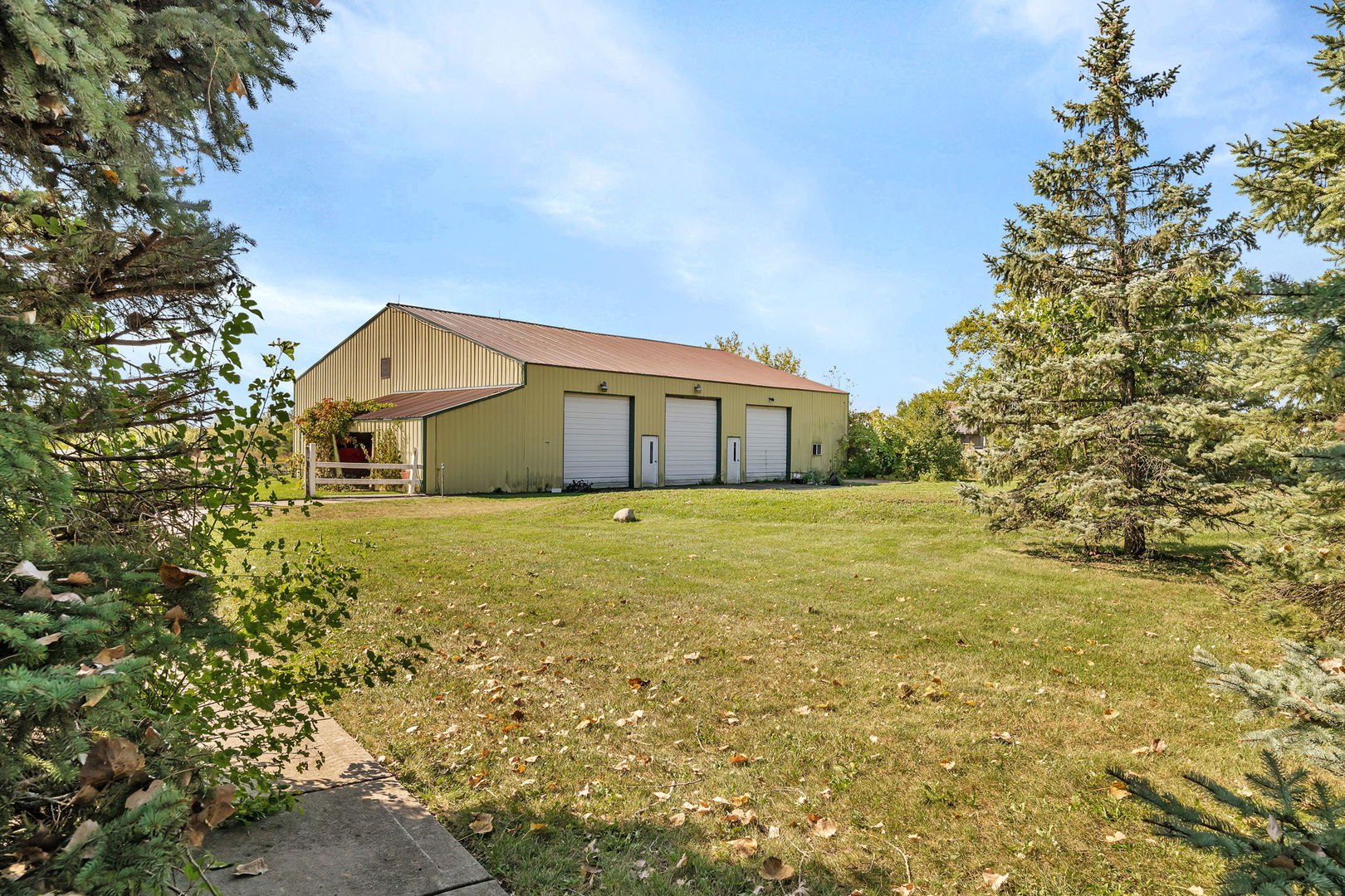 9417 West Steger Road Frankfort, IL 60423 - Photo 35 of 52 a front view of a house with a garden