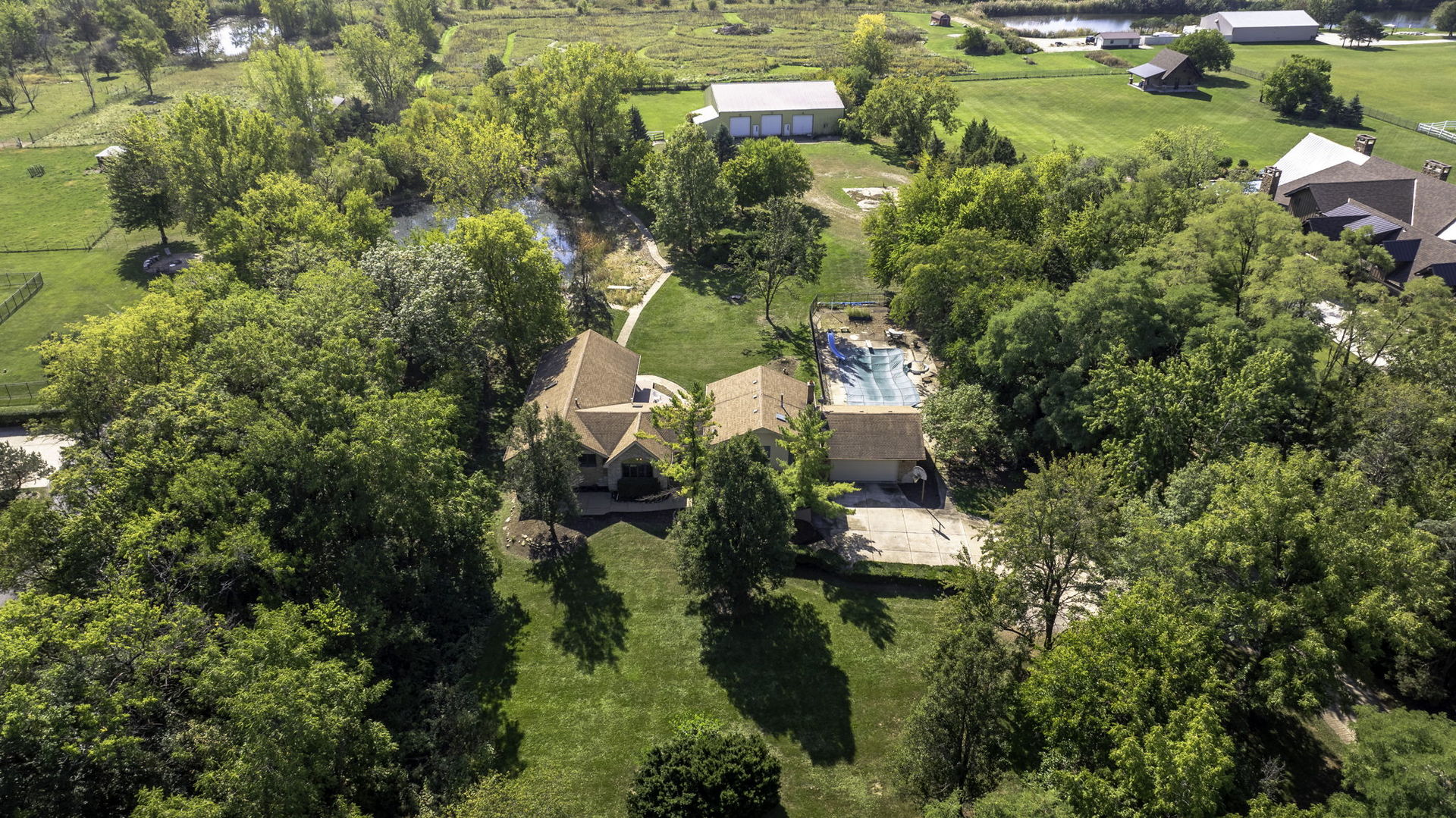 9417 West Steger Road Frankfort, IL 60423 - Photo 40 of 52 an aerial view of residential houses with outdoor space and trees