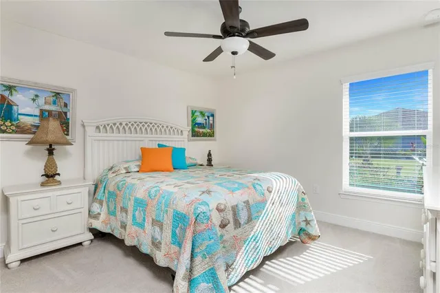 a bedroom with a bed closet and window