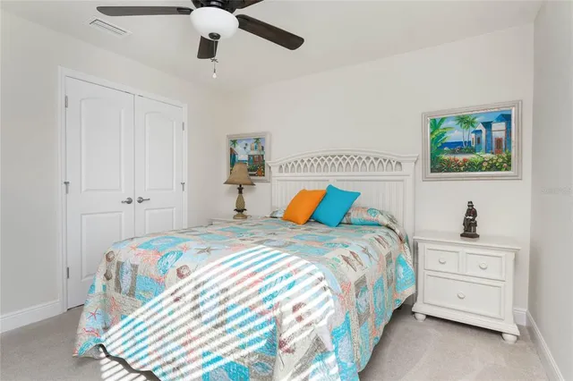 a bedroom with bed and a chandelier