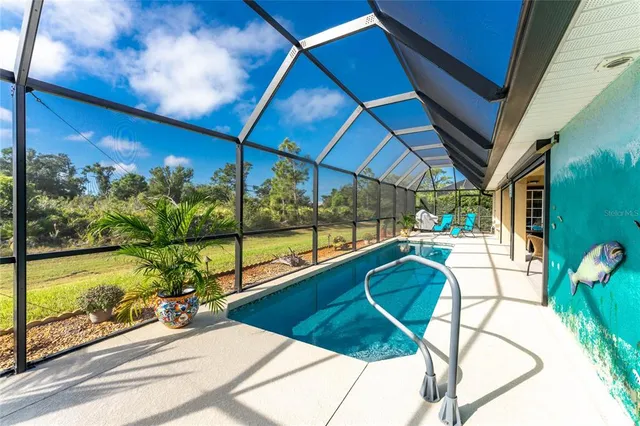 a view of a swimming pool with a porch