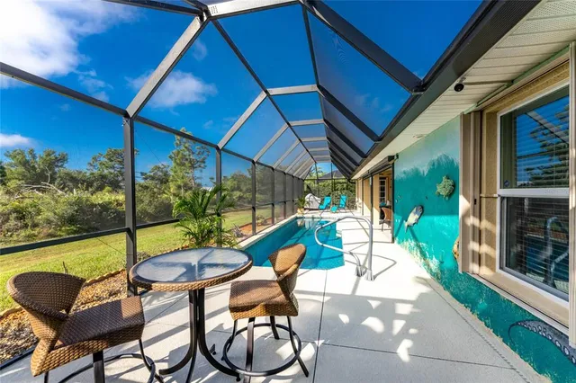 a view of a patio with a table and chairs