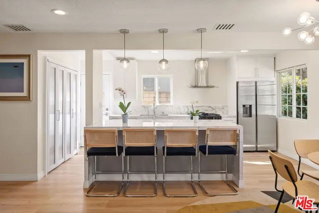 a dining table chairs and entryway