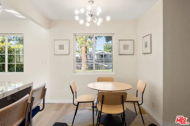 a view of a dining room with furniture and window