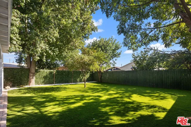 a view of swimming pool with a yard