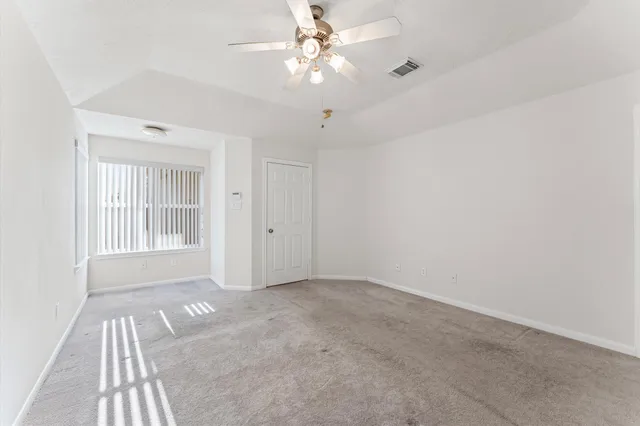 a spacious bathroom with a tub sink shower and mirror