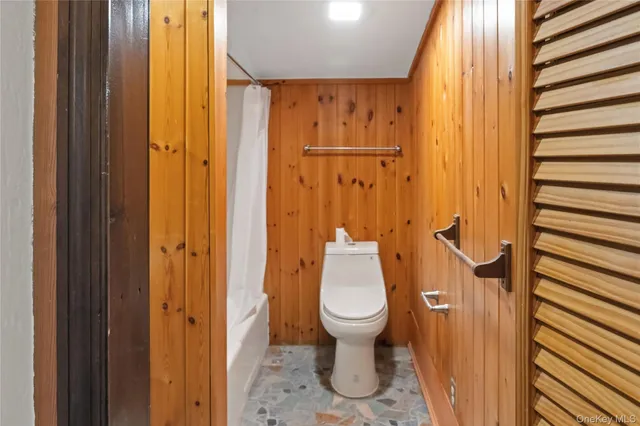 an empty room with a wooden door