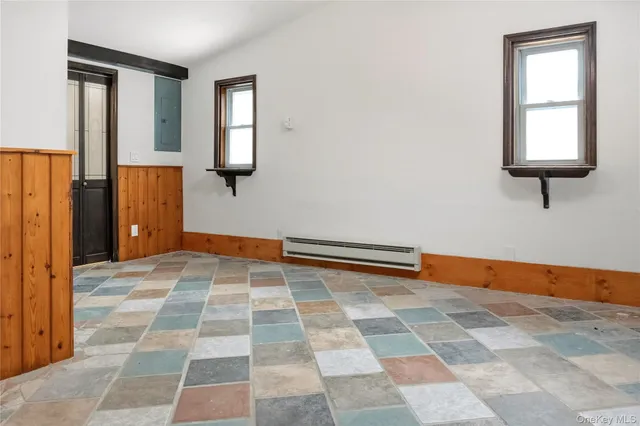 an empty room with windows and closet