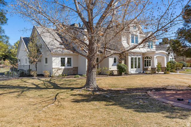 2917 Old Farm Road Washington, UT 84780 - Photo 43 of 105 View of front of home with a front yard, stone siding, and a chimney