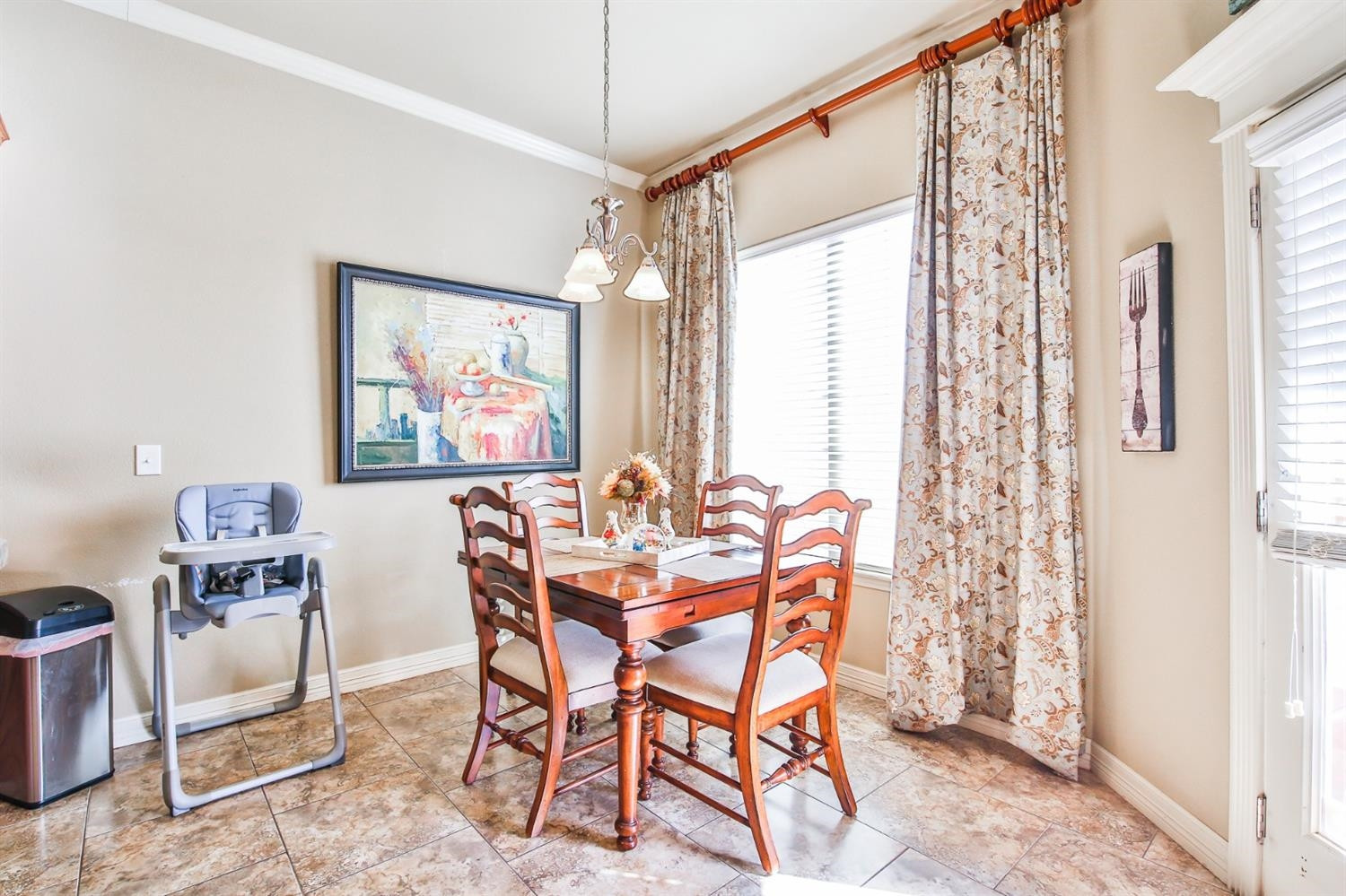 6205 101st Place Lubbock, TX 79424 - Photo 15 of 37 a dining room with furniture and window