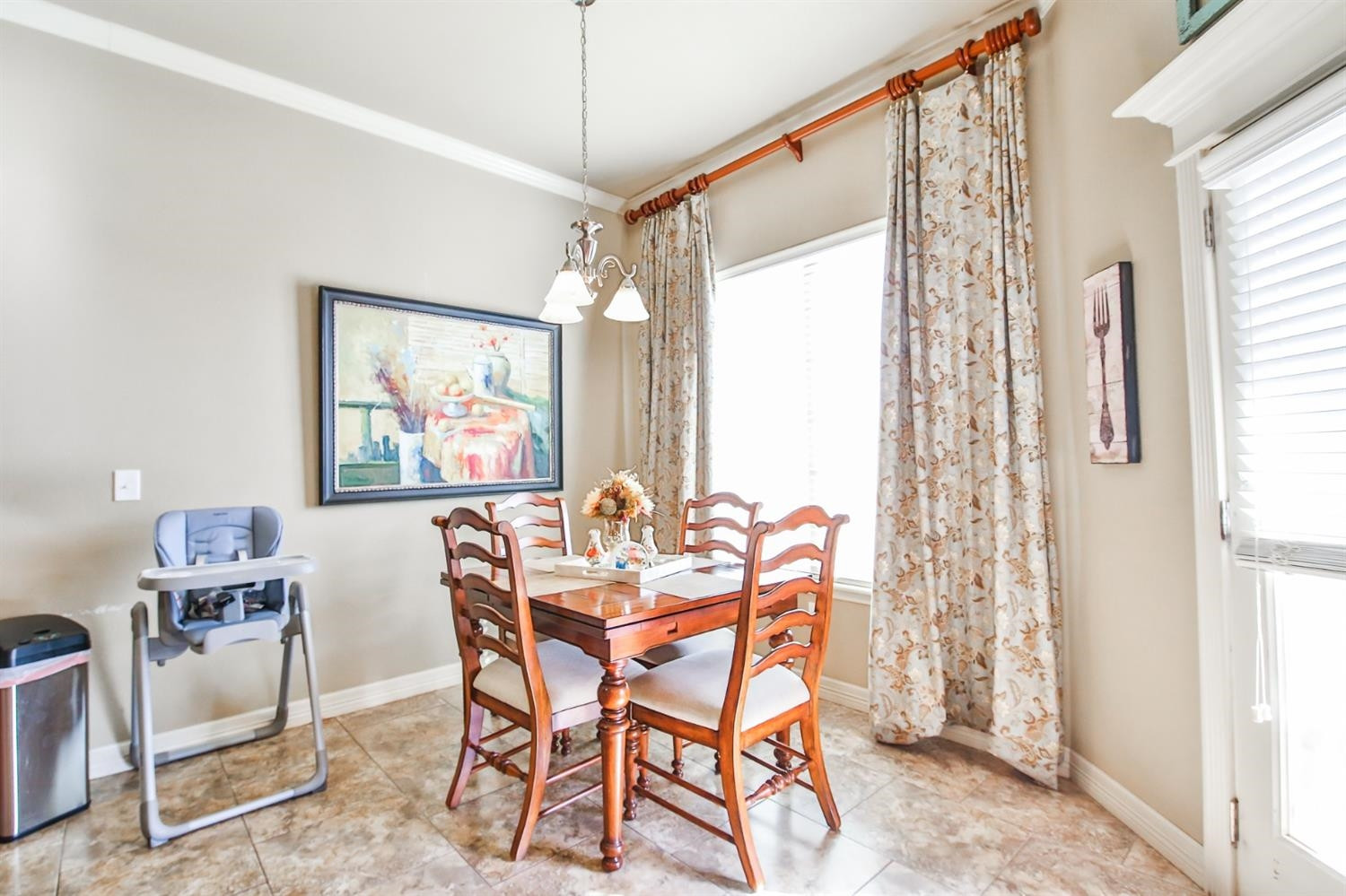 6205 101st Place Lubbock, TX 79424 - Photo 16 of 37 a dining room with furniture and window