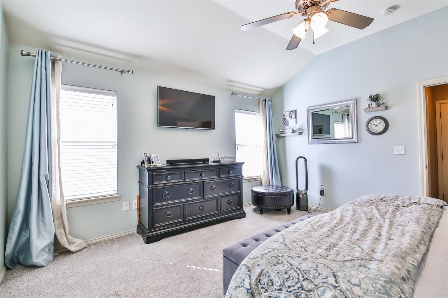 6205 101st Place Lubbock, TX 79424 - Photo 21 of 37 a bedroom with a bed and a television