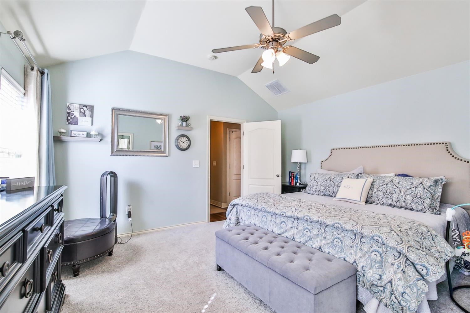 6205 101st Place Lubbock, TX 79424 - Photo 22 of 37 a bedroom with a bed furniture and a window