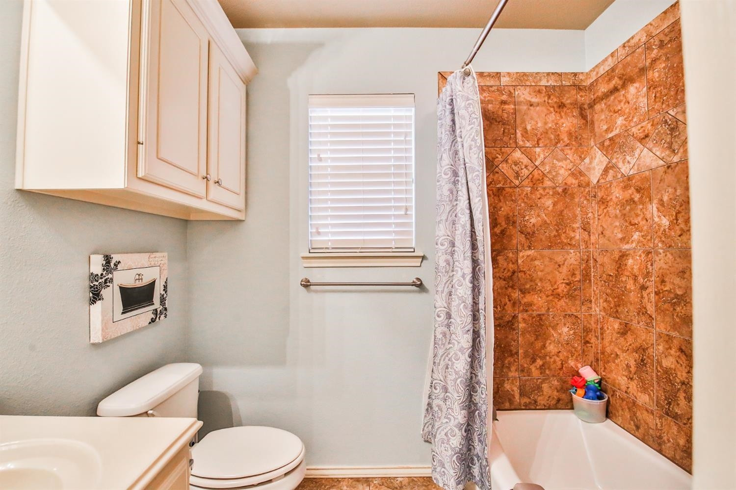 6205 101st Place Lubbock, TX 79424 - Photo 31 of 37 a bathroom with a sink toilet and shower