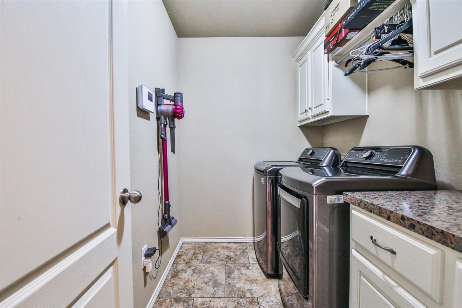 6205 101st Place Lubbock, TX 79424 - Photo 33 of 37 a view of a storage and utility room with a sink