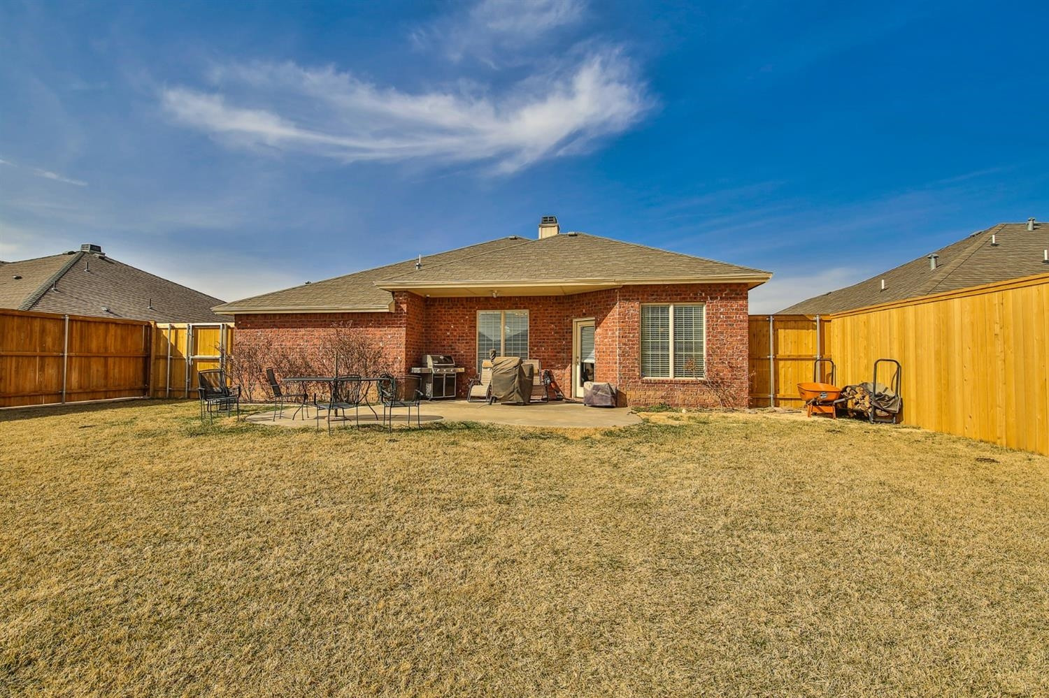 6205 101st Place Lubbock, TX 79424 - Photo 36 of 37 a view of a house with backyard porch and furniture
