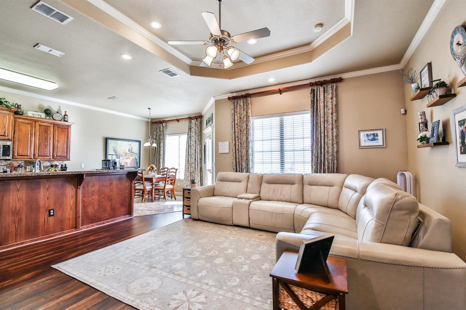 6205 101st Place Lubbock, TX 79424 - Photo 7 of 37 a living room with furniture and a wooden floor