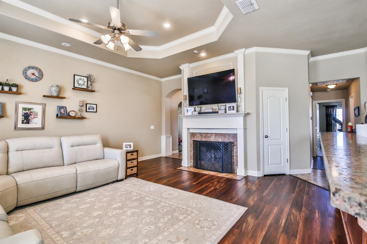 6205 101st Place Lubbock, TX 79424 - Photo 8 of 37 a living room with furniture and a fireplace