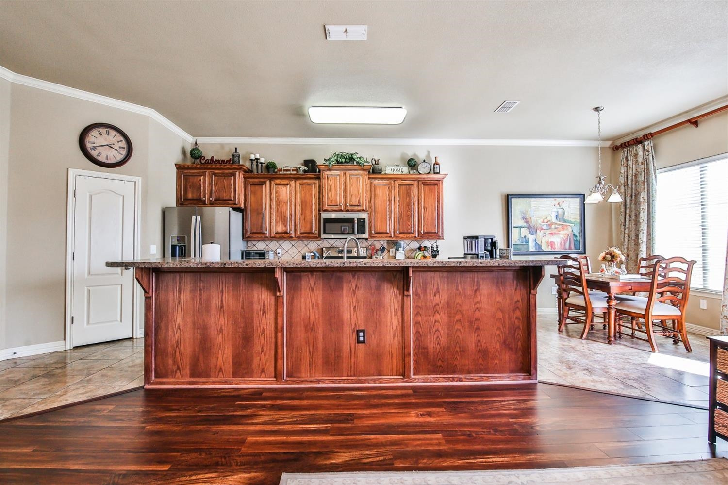 6205 101st Place Lubbock, TX 79424 - Photo 10 of 37 a view of kitchen with furniture and wooden floor