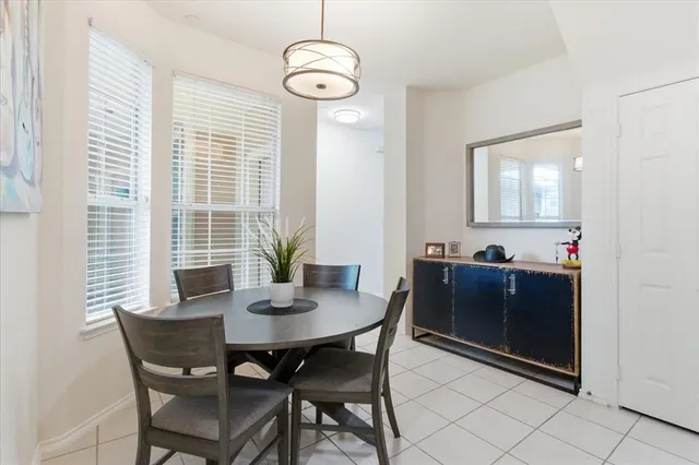 a view of a dining room with furniture and window