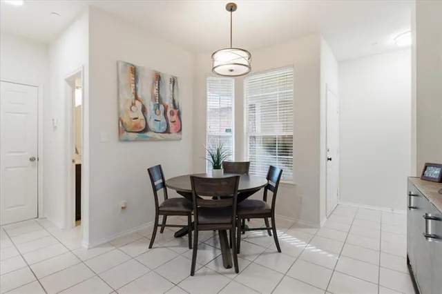 a view of a dining room with furniture and window