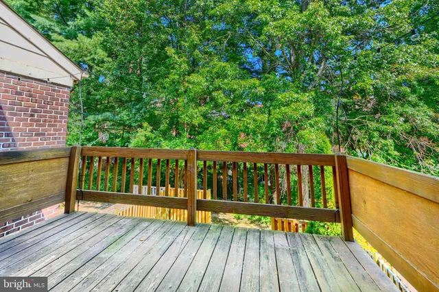 a view of balcony with wooden floor