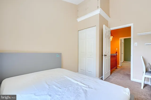 a bedroom with a bed and a furniture