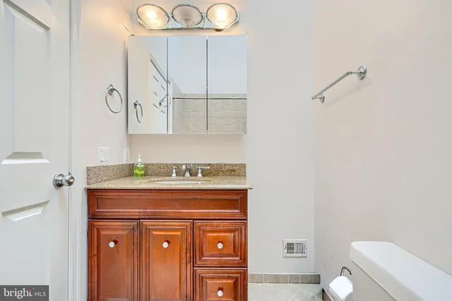 a stove top oven sitting inside of a kitchen