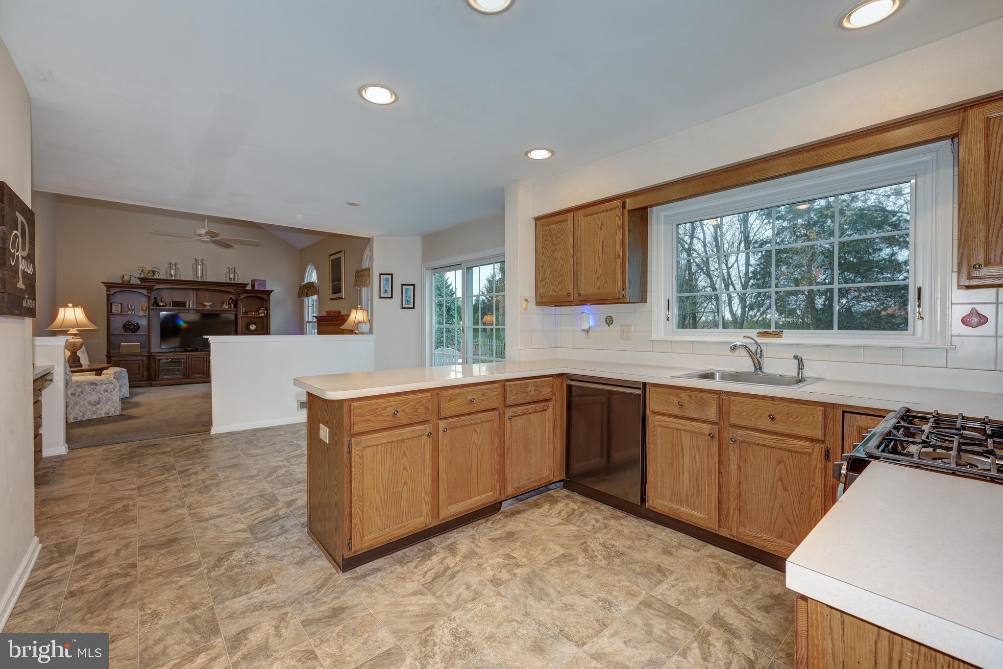 9 Swift Court Medford, NJ 08055 - Photo 15 of 54 a large kitchen with kitchen island granite countertop a sink and a stove