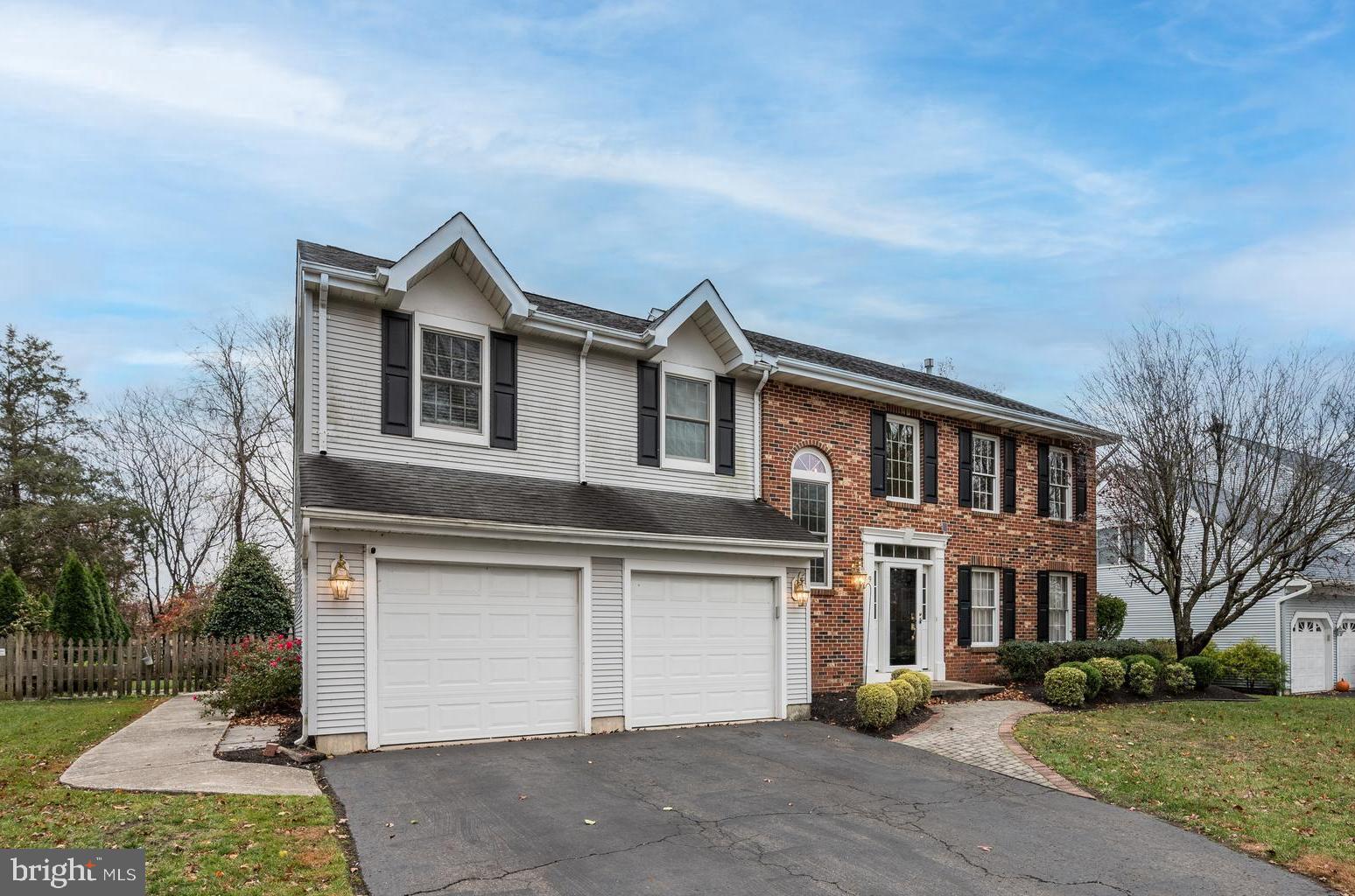 9 Swift Court Medford, NJ 08055 - Photo 2 of 54 a front view of a house with a yard