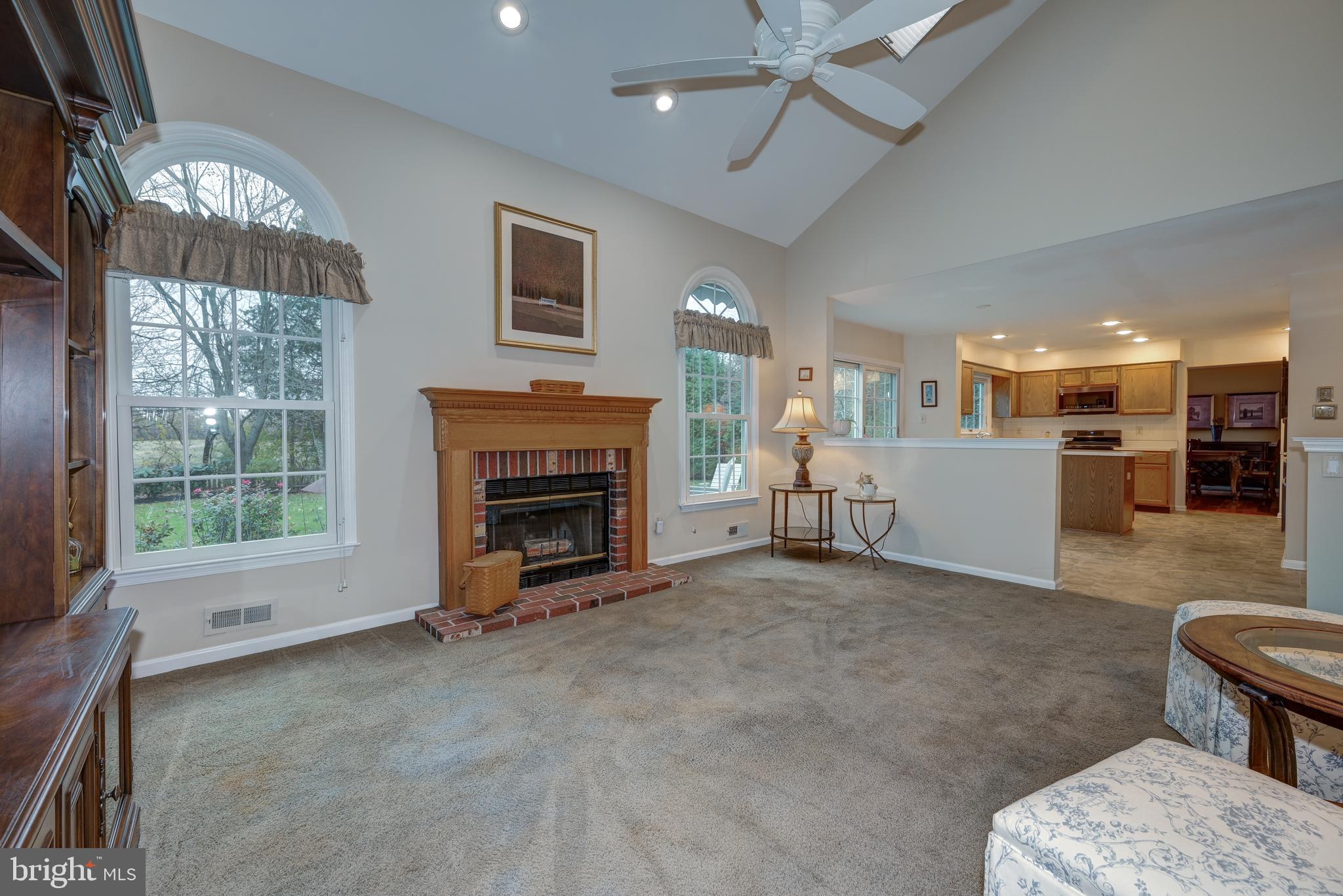 9 Swift Court Medford, NJ 08055 - Photo 23 of 54 a living room with furniture and a fireplace