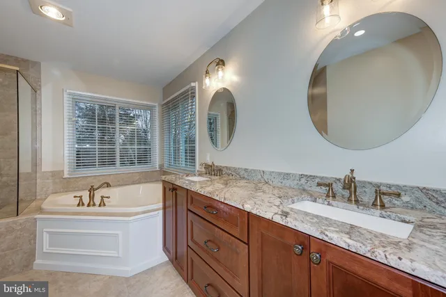 a bathroom with a tub and a shower