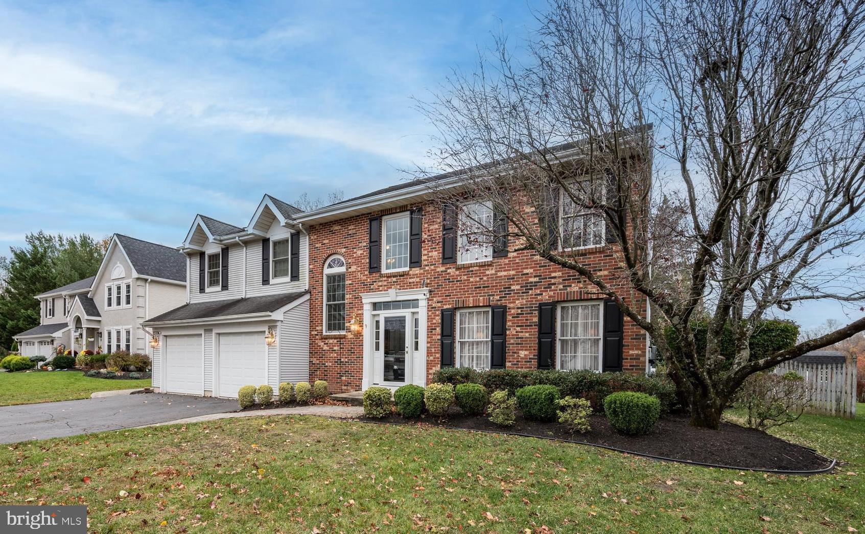 9 Swift Court Medford, NJ 08055 - Photo 3 of 54 a front view of a house with garden