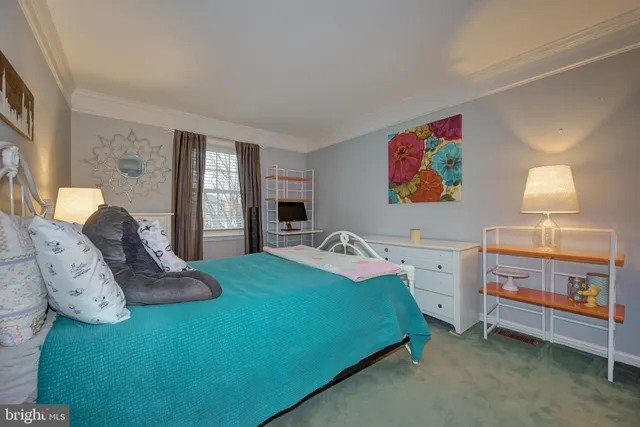 a bathroom with a sink toilet and window