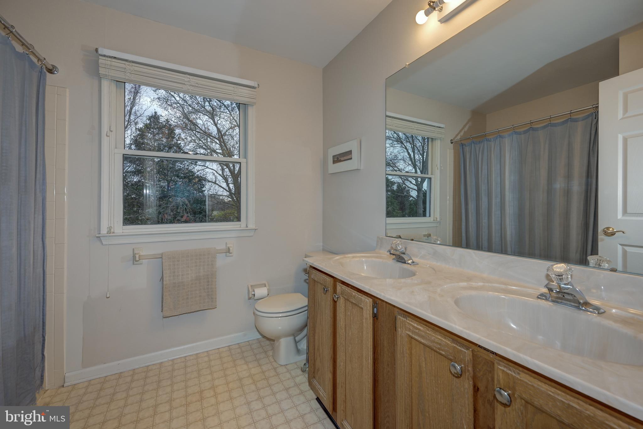 9 Swift Court Medford, NJ 08055 - Photo 36 of 54 a bathroom with a sink toilet and window