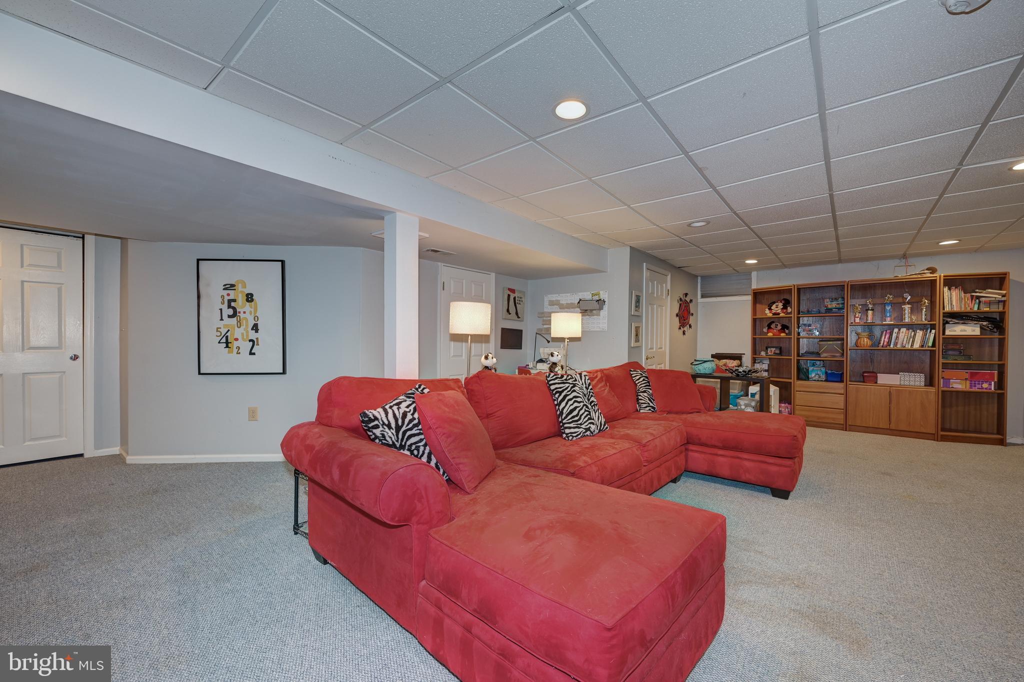 9 Swift Court Medford, NJ 08055 - Photo 37 of 54 a living room with furniture and lots of books