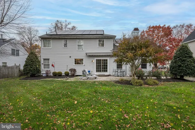 a view of backyard with sitting area