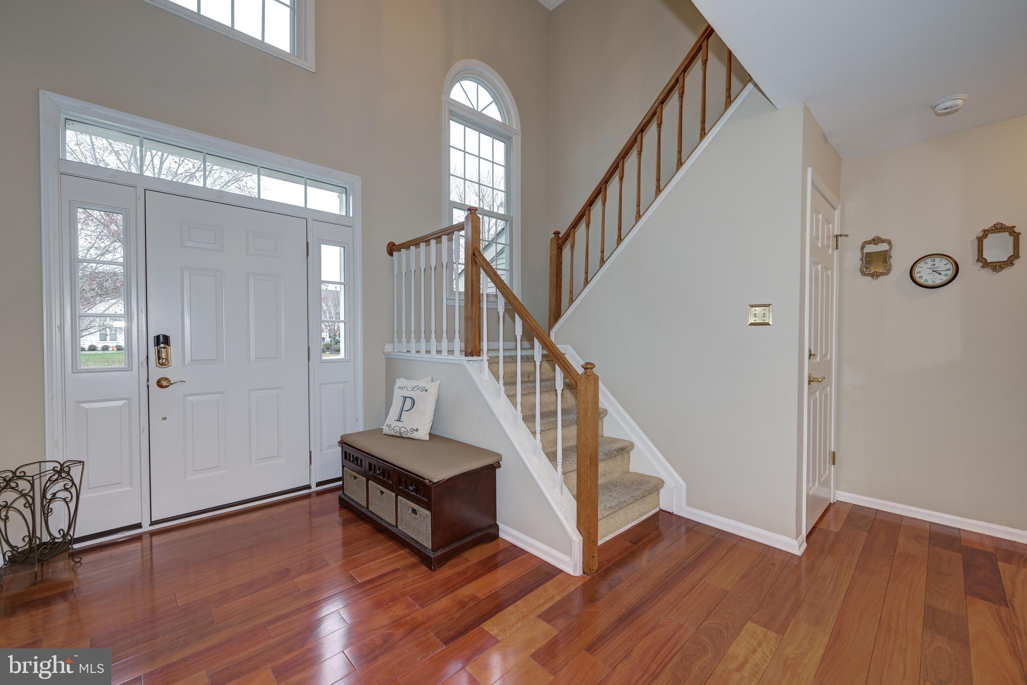 9 Swift Court Medford, NJ 08055 - Photo 5 of 54 a view of an entryway with wooden floor and stairs