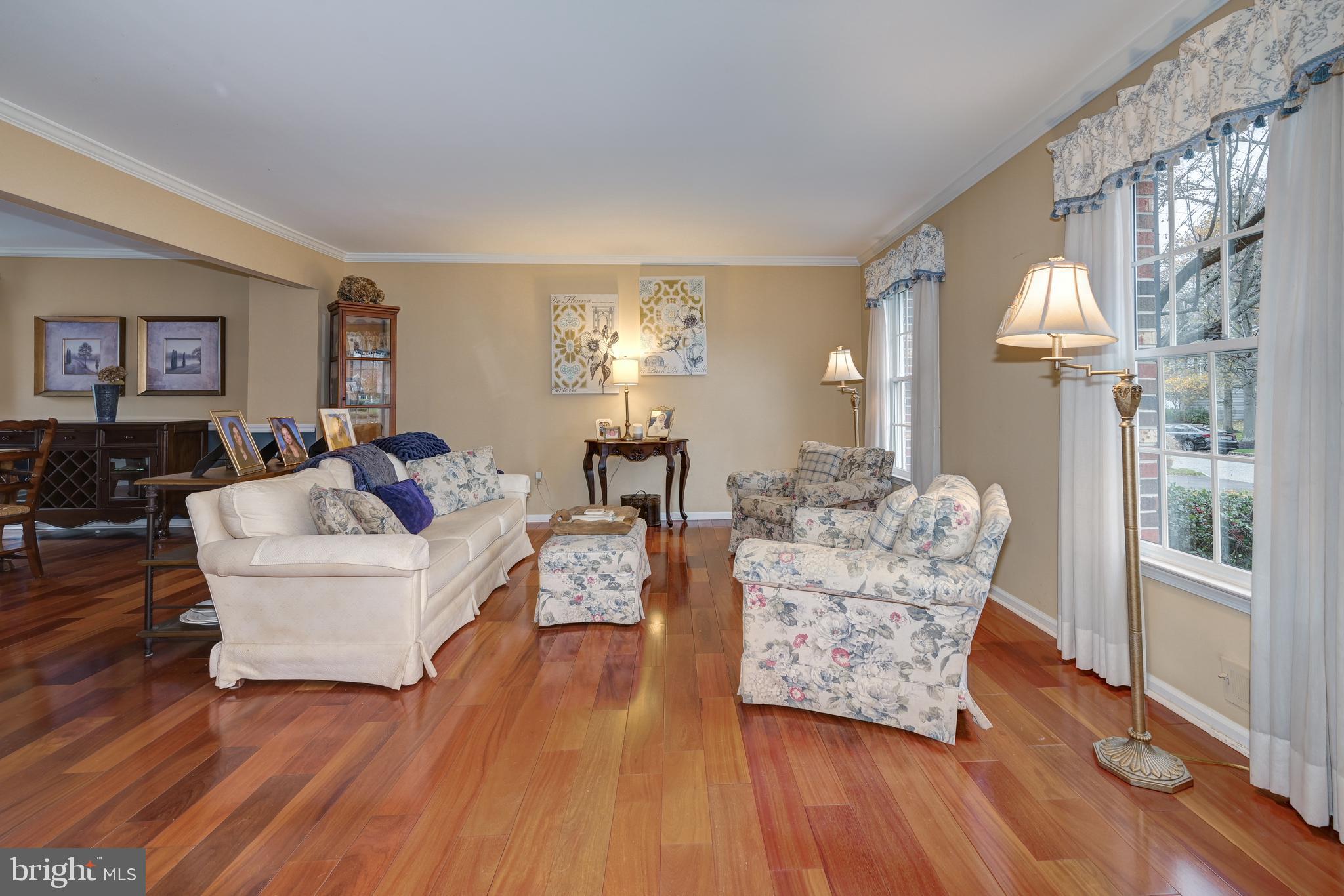 9 Swift Court Medford, NJ 08055 - Photo 7 of 54 a living room with furniture and a chandelier