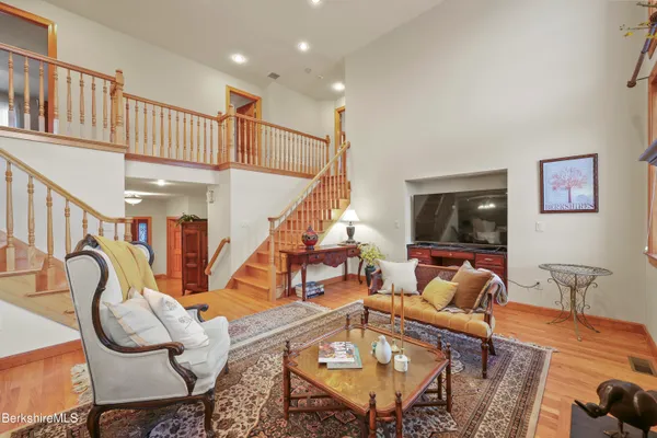 a spacious bedroom with a bed and a large window