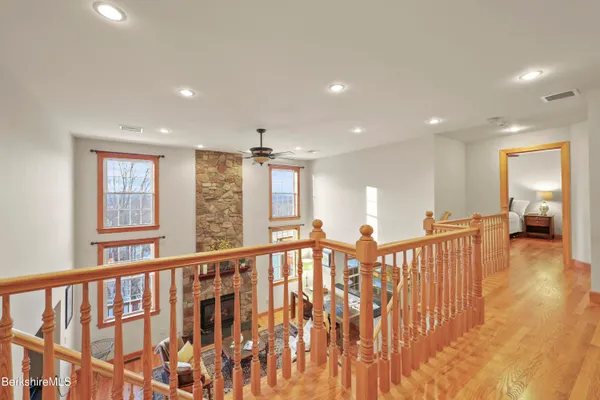 a view of terrace with lawn chairs and iron fence
