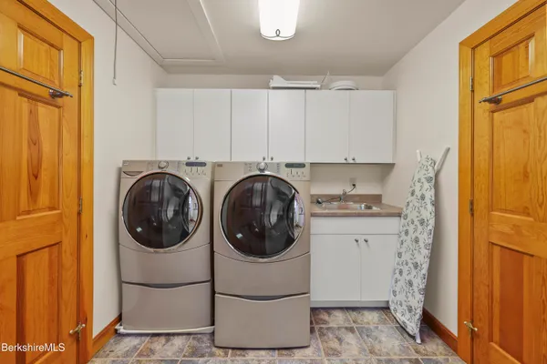 an aerial view of residential house with parking