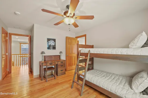 an aerial view of a swimming pool with a mountain