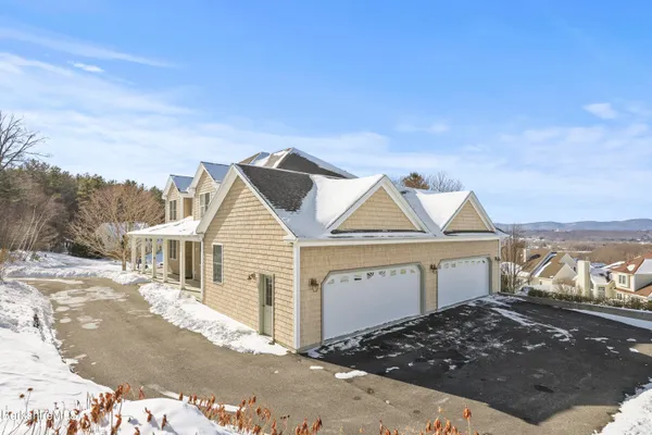 a view of entryway livingroom and hall with wooden floor